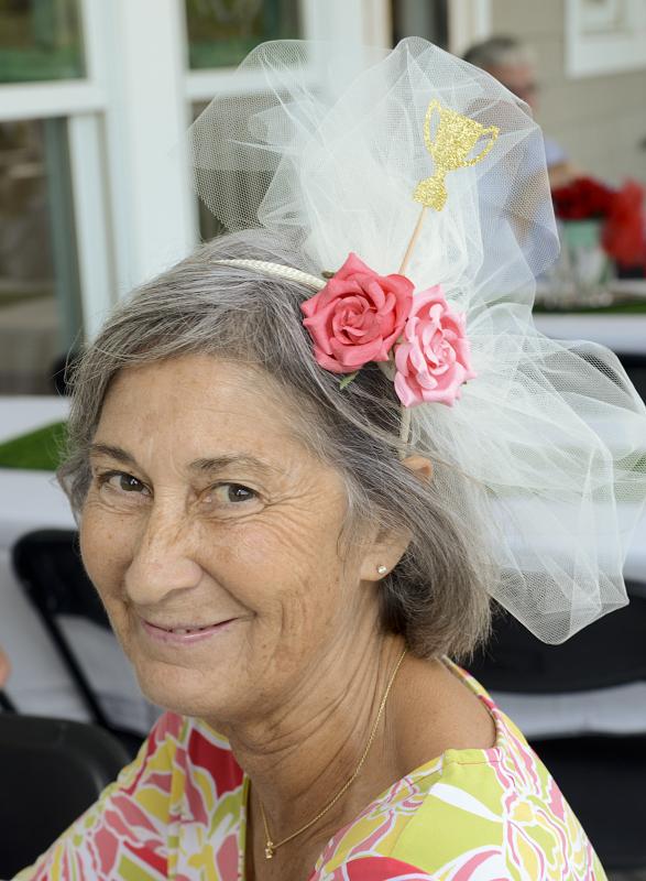 Helen Schneck sports a delicate fascinator.